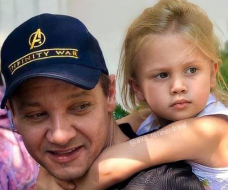 Ava Berlin Renner father Jeremy Renner giving her a piggyback ride.